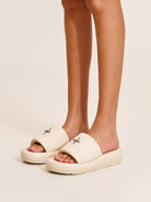 SMFK Cowhide Leather Cross Hardware Slides in Cream - On Model