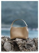 HONGU Cowhide Crossbody Bucket Bag in Taupe - Lifestyle