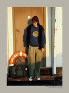USAGE Washed Cotton Raglan Smiley Sweatshirt in Blue - On Male Model