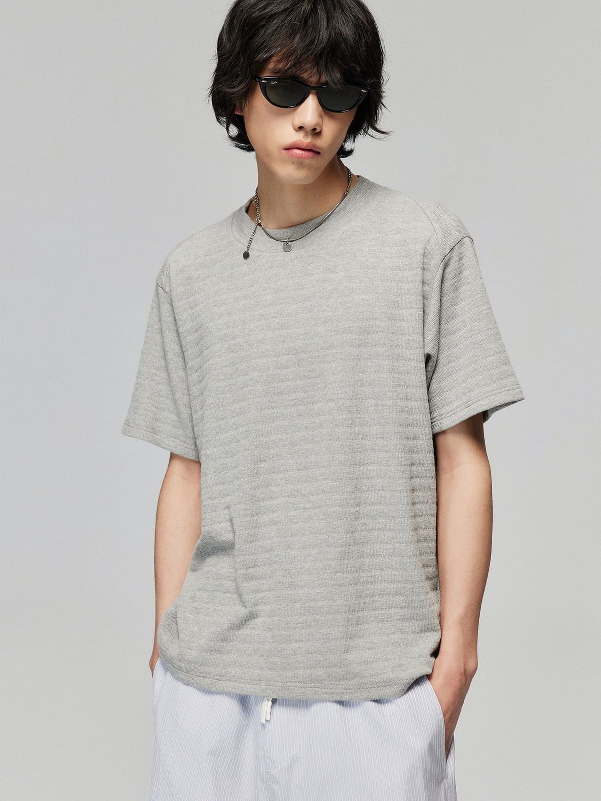 SIMPLE PROJECT Textured Diagonal Paneled T Shirt in Heather Gray - On Male Model