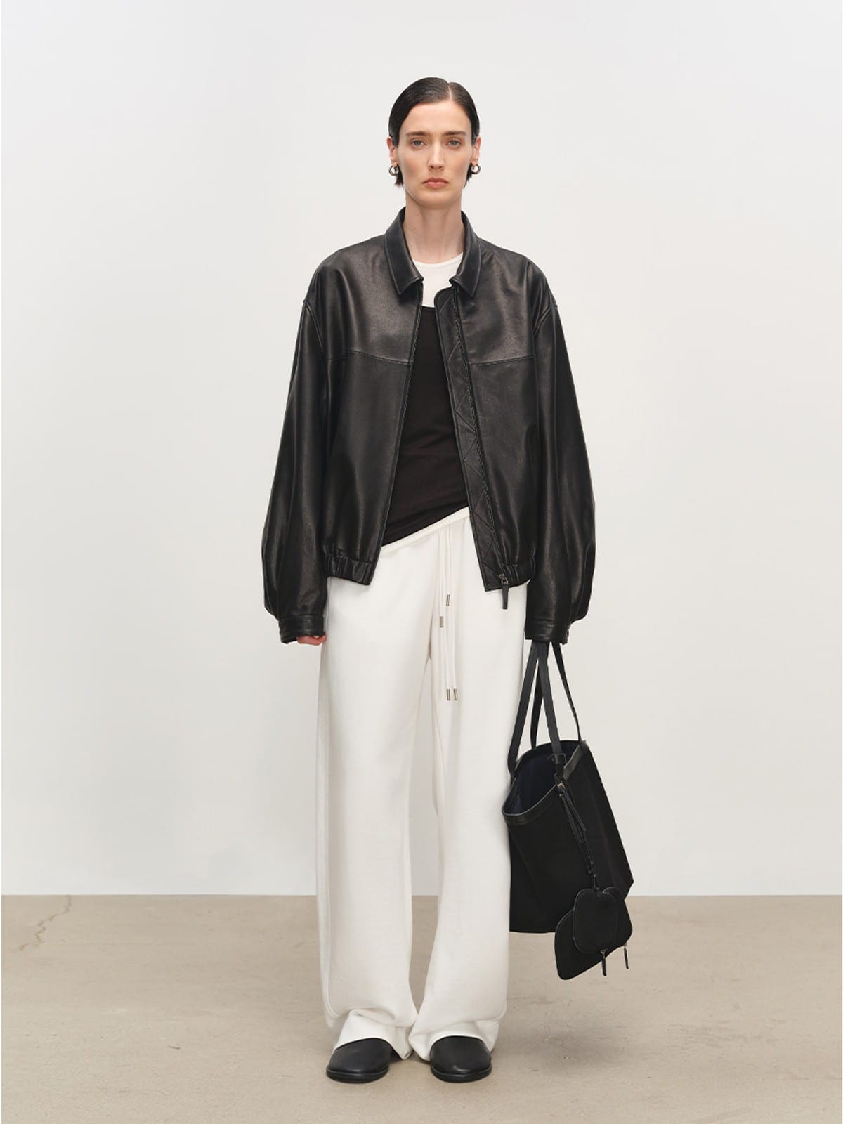 MSBEAST Broad Shoulder Sheepskin Jacket in Black - On Female Model