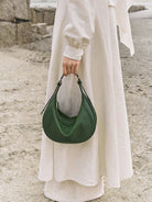 QIUZHEN Vegetable Tanned Leather Crescent Bag in Green - On Model