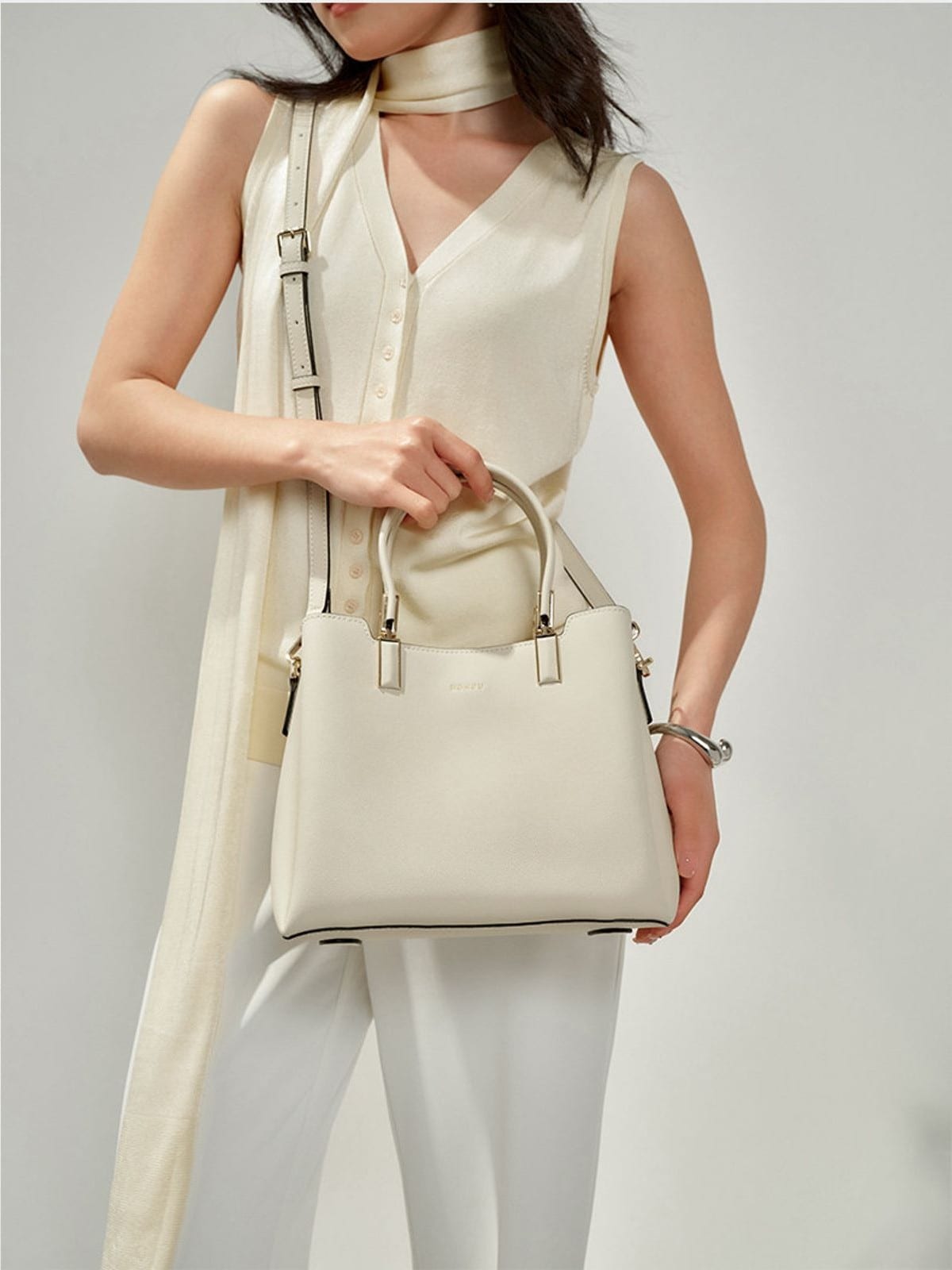 HONGU Split Cowhide Crossbody Handbag in White - On Female Model
