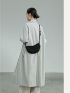 QIUZHEN Vegetable Tanned Leather Crescent Bag in Black - On Female Model