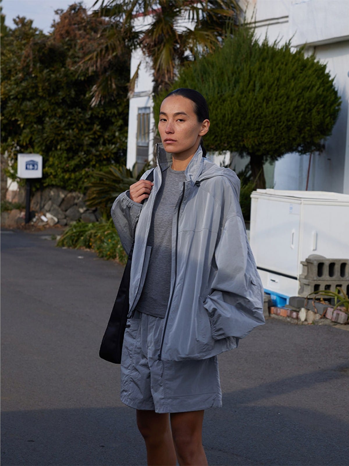 Random Piece Lightweight Cropped Hooded Nylon Jacket in Gray - On Female Model