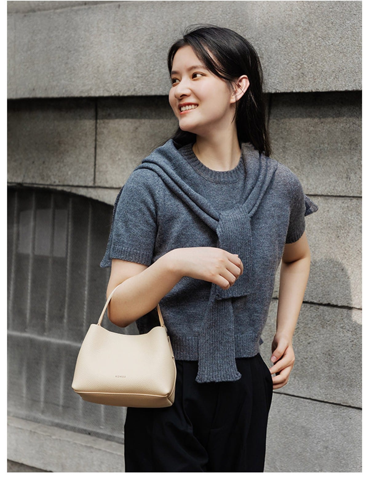 HONGU Cowhide Crossbody Bucket Bag in Beige - On Female Model