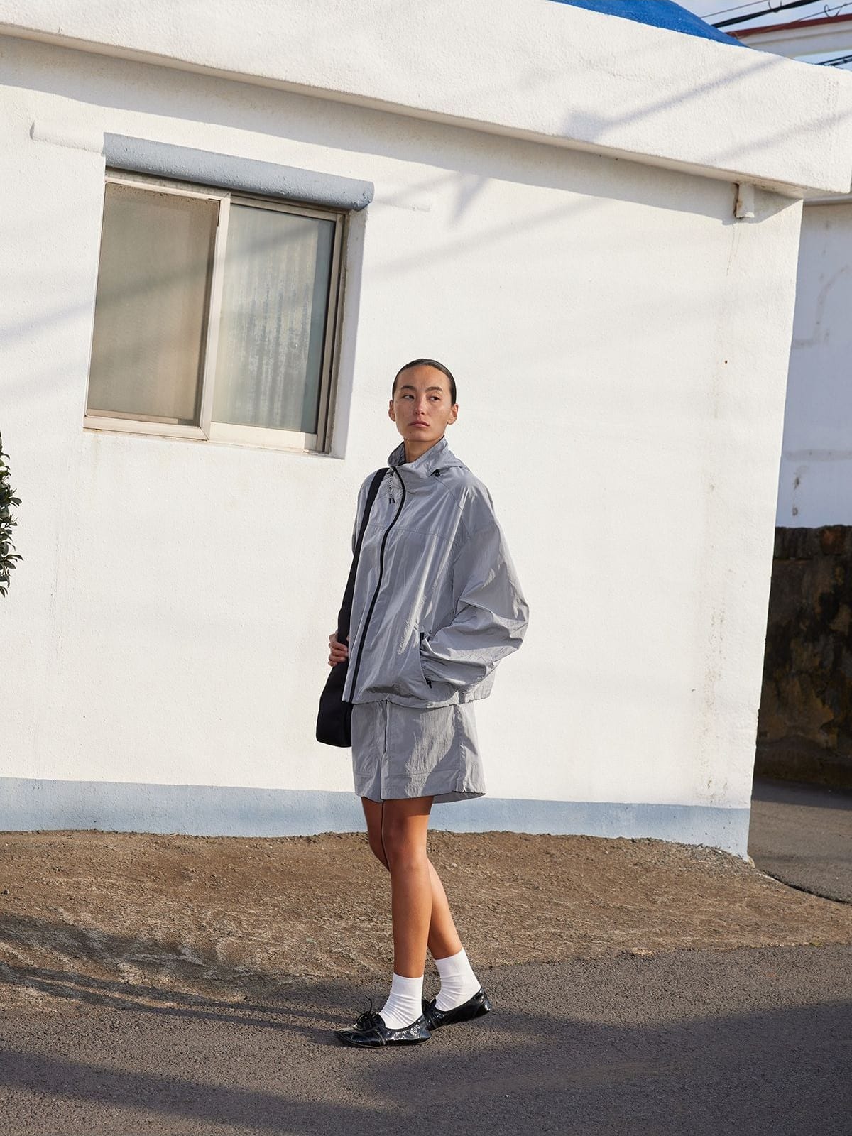 Random Piece Lightweight Cropped Hooded Nylon Jacket in Gray - On Female Model