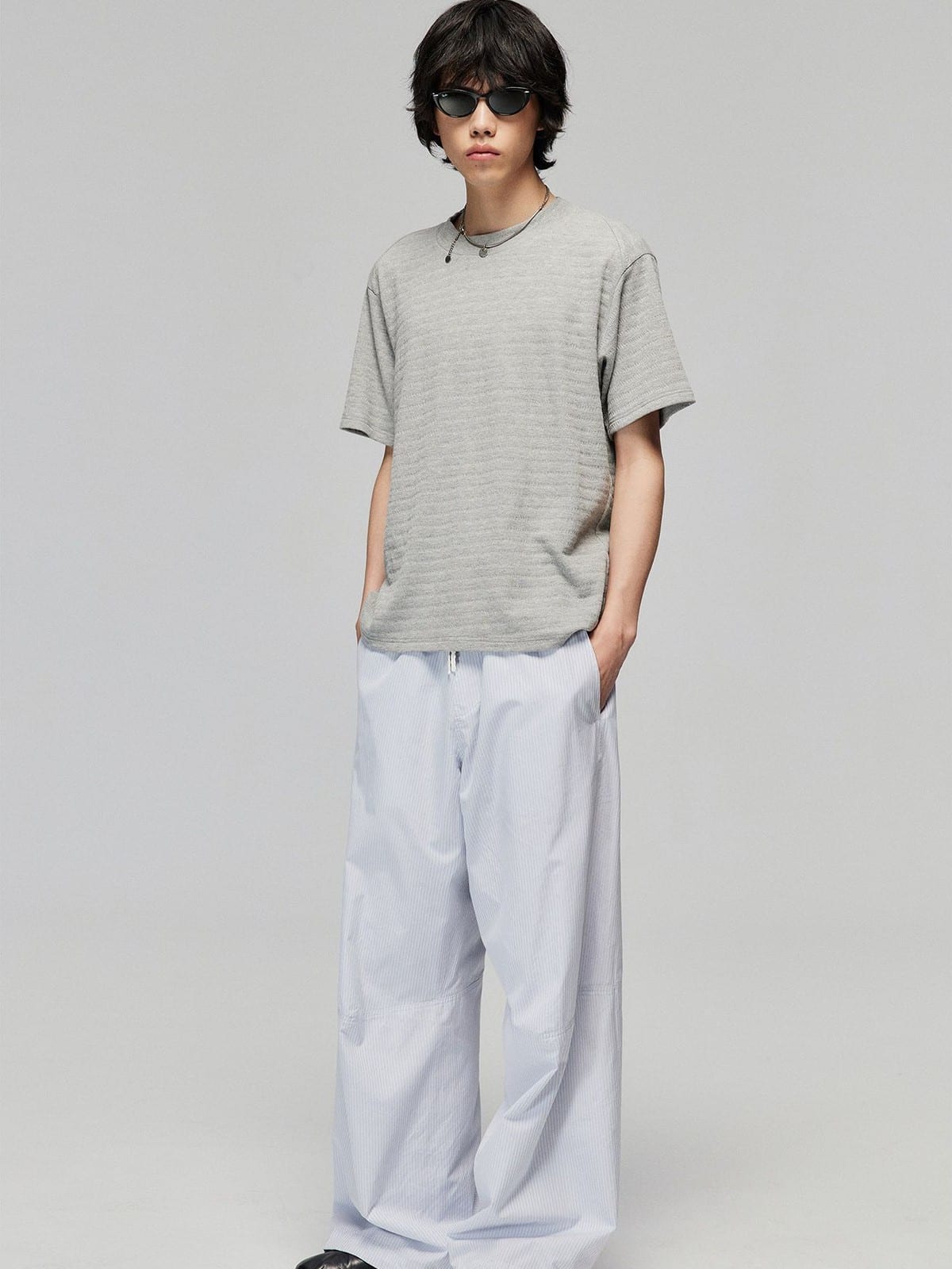 SIMPLE PROJECT Textured Diagonal Paneled T Shirt in Heather Gray - On Male Model