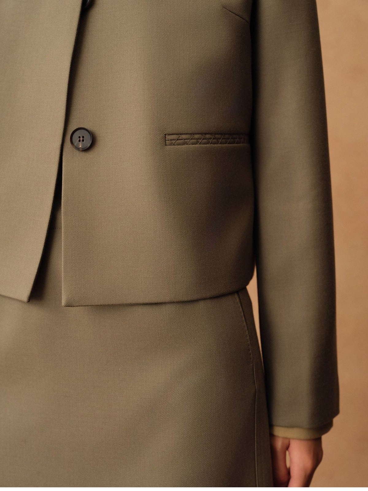 TEASEL Merino Wool Pleated Trousers in Olive - On Model
