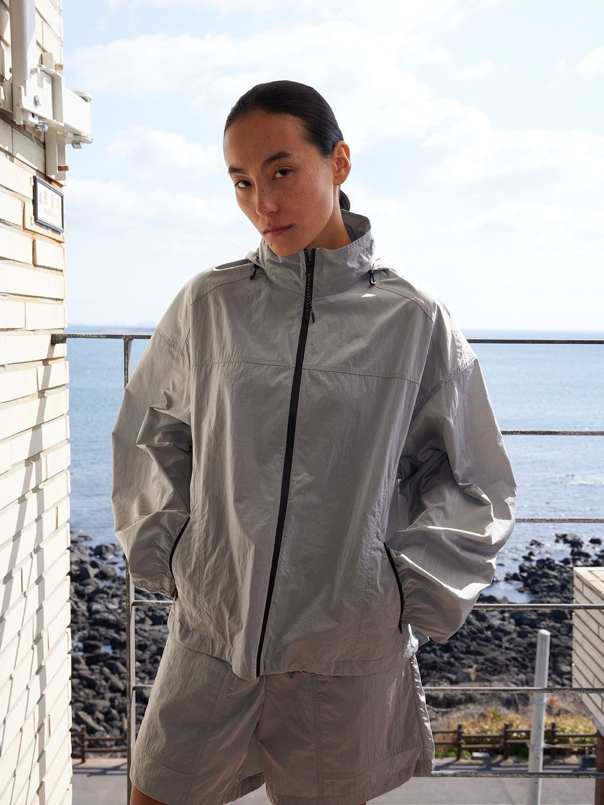 Random Piece Lightweight Cropped Hooded Nylon Jacket in Gray - On Female Model