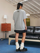 MEDM Pearl Embellished Letter Cotton T Shirt in Gray - On Model