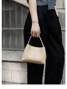 HONGU Cowhide Crossbody Bucket Bag in Beige - On Model
