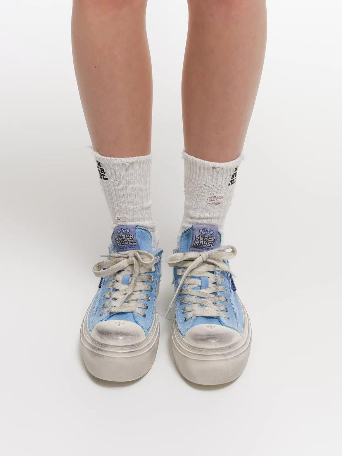 SMFK Distressed Canvas Skate Sneakers in Sky Blue - On Model