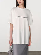 Random Piece Script Letter Print Cotton T Shirt in White - On Female Model