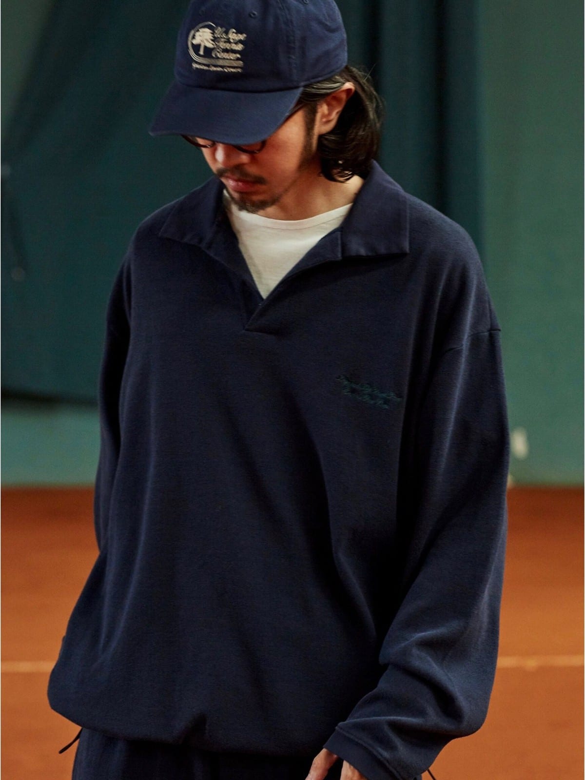 USAGE Oversized Textured Long Sleeve Polo in Navy Blue - On Male Model