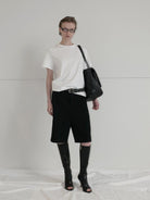 RARELY ALIKE Tailored Bermuda Shorts in Black - On Female Model