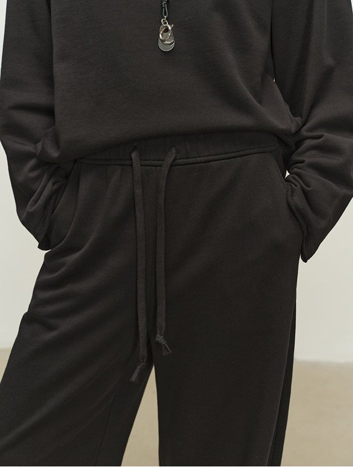 MSBEAST Cotton Terry Sweatshirt Tapered Joggers in Black - On Model
