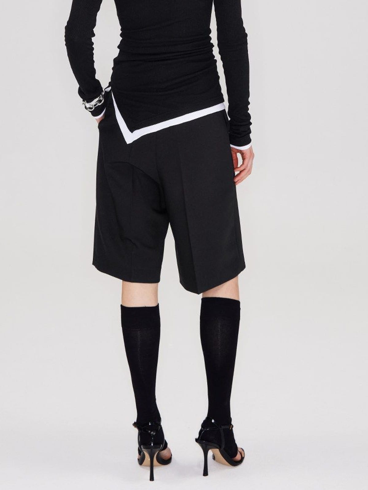 RARELY ALIKE Tailored Bermuda Shorts in Black - On Model