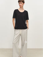MSBEAST Rolled Edge Silk Cotton U Neck T Shirt in Black - On Female Model