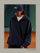 USAGE Oversized Textured Long Sleeve Polo in Navy Blue - On Male Model