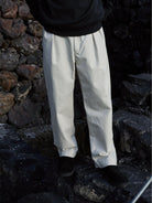 USAGE Pleated Cotton Twill Chinos in White - On Model