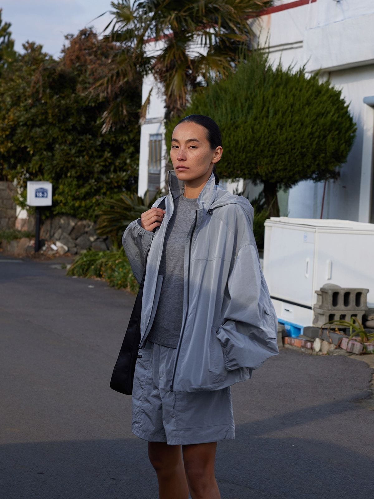 Random Piece Lightweight Cropped Hooded Nylon Jacket in Gray - On Female Model