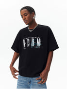 MEDM Vintage Logo Typography Cotton T Shirt in Black - On Male Model