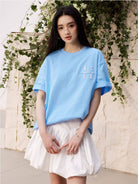MEDM Tufted Logo Cotton T Shirt in Sky Blue - On Female Model