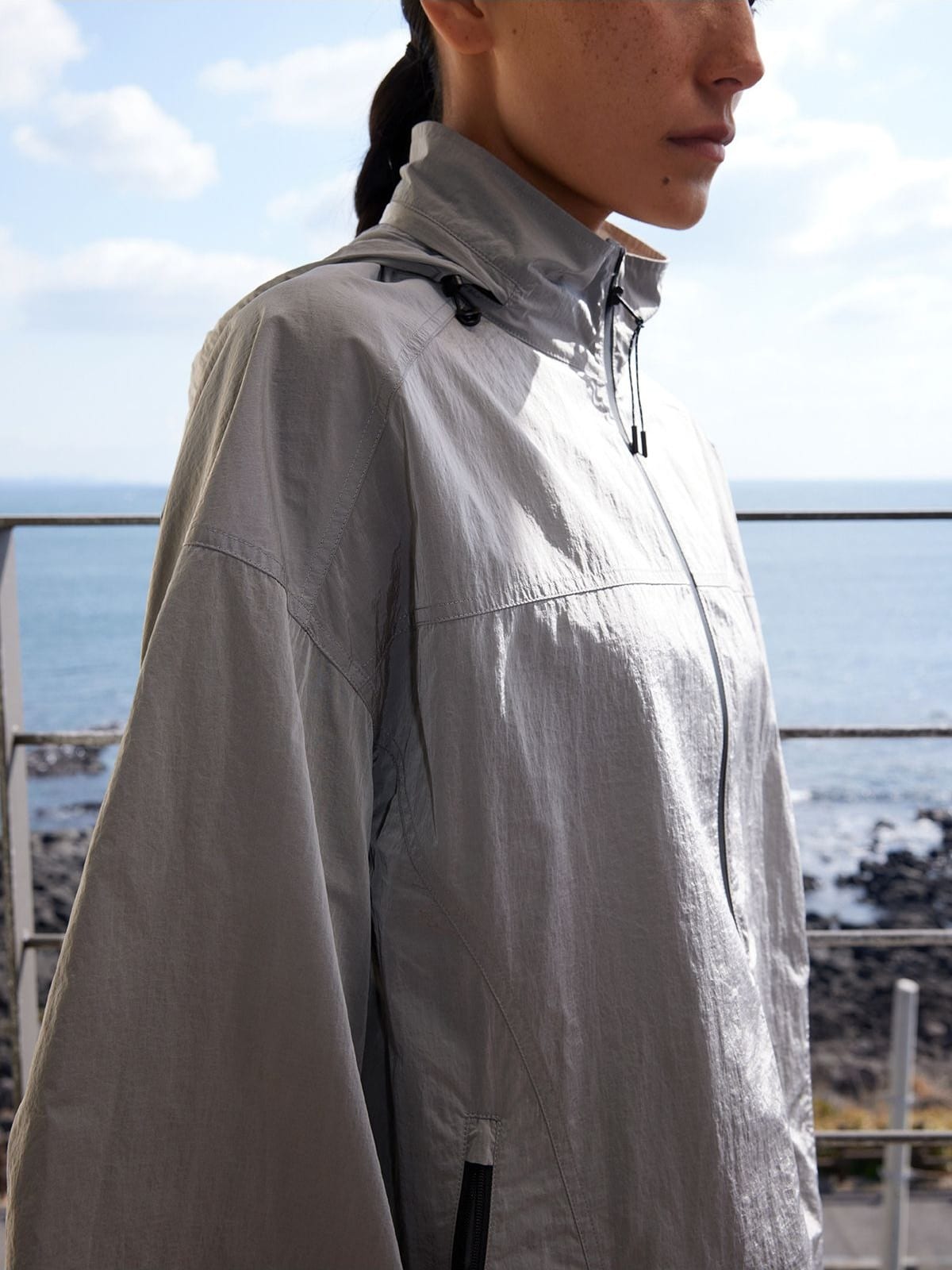 Random Piece Lightweight Cropped Hooded Nylon Jacket in Gray - On Female Model