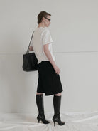 RARELY ALIKE Tailored Bermuda Shorts in Black - On Model