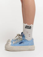 SMFK Distressed Canvas Skate Sneakers in Sky Blue - On Model