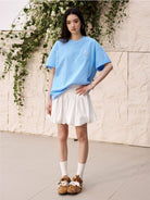MEDM Tufted Logo Cotton T Shirt in Sky Blue - On Female Model