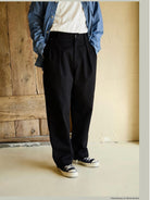USAGE Pleated Cotton Twill Chinos in Black - On Model