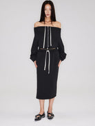 RARELY ALIKE Cotton Side Slit Midi Skirt in Black - On Female Model