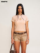 SMFK Cross Graphic Cropped T Shirt in Beige - On Female Model
