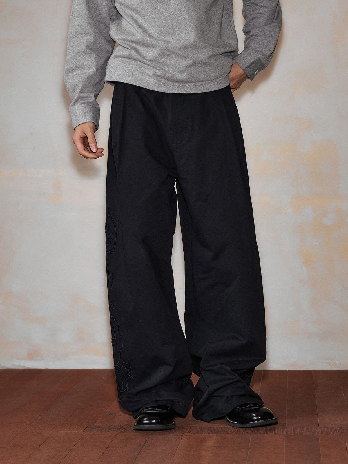 MEDM Embroidered Cotton Cargo Pants in Black - On Model