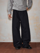 MEDM Embroidered Cotton Cargo Pants in Black - On Model