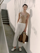 MSBEAST Cotton Blend Tapered Cropped Trousers in White - On Female Model