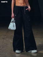 SMFK Garment Dyed Cargo Parachute Pants in Black - On Female Model