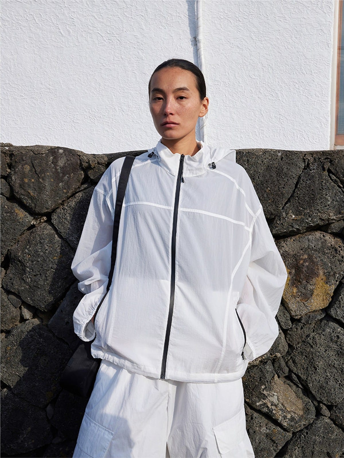 Random Piece Lightweight Cropped Hooded Nylon Jacket in White - On Female Model