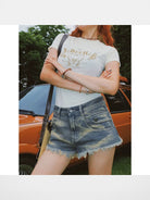 BeerBro Distressed Raw Hem Denim Shorts in Denim - On Female Model