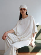 MSBEAST Oversized Acetate Satin T Shirt in White - On Female Model