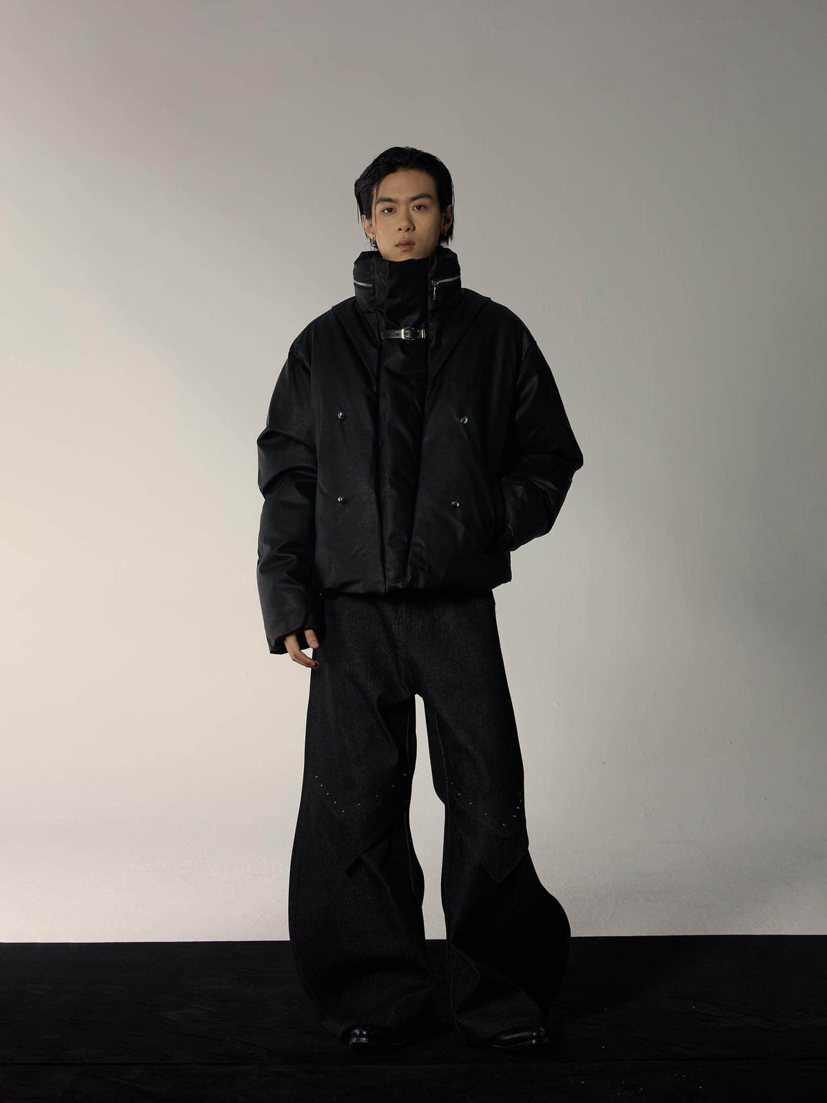 Y OFFICIAL Cropped Faux Leather Down Puffer in Black - On Male Model