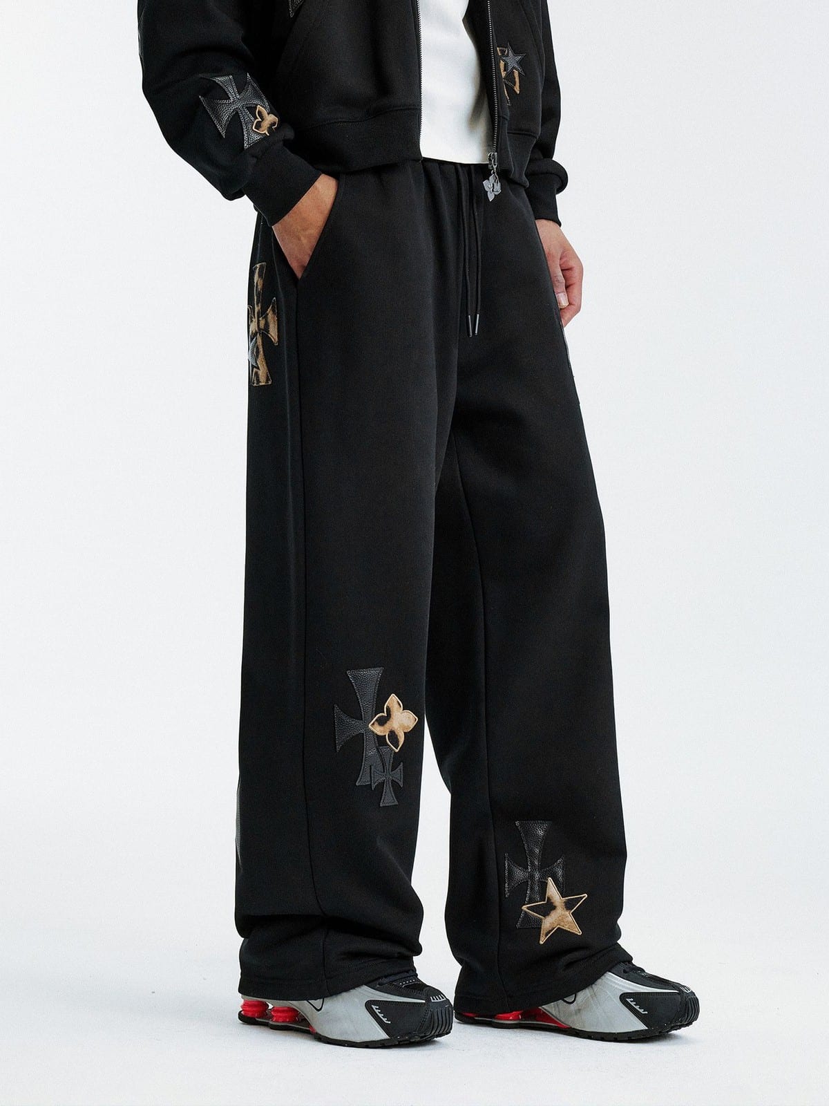 MEDM Leopard Leather Patch Drawstring Pants in Black - On Male Model