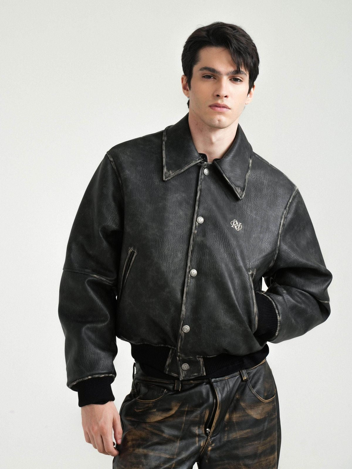 Retro 21 Distressed Faux Leather Padded Jacket in Black - On Male Model