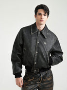 Retro 21 Distressed Faux Leather Padded Jacket in Black - On Male Model