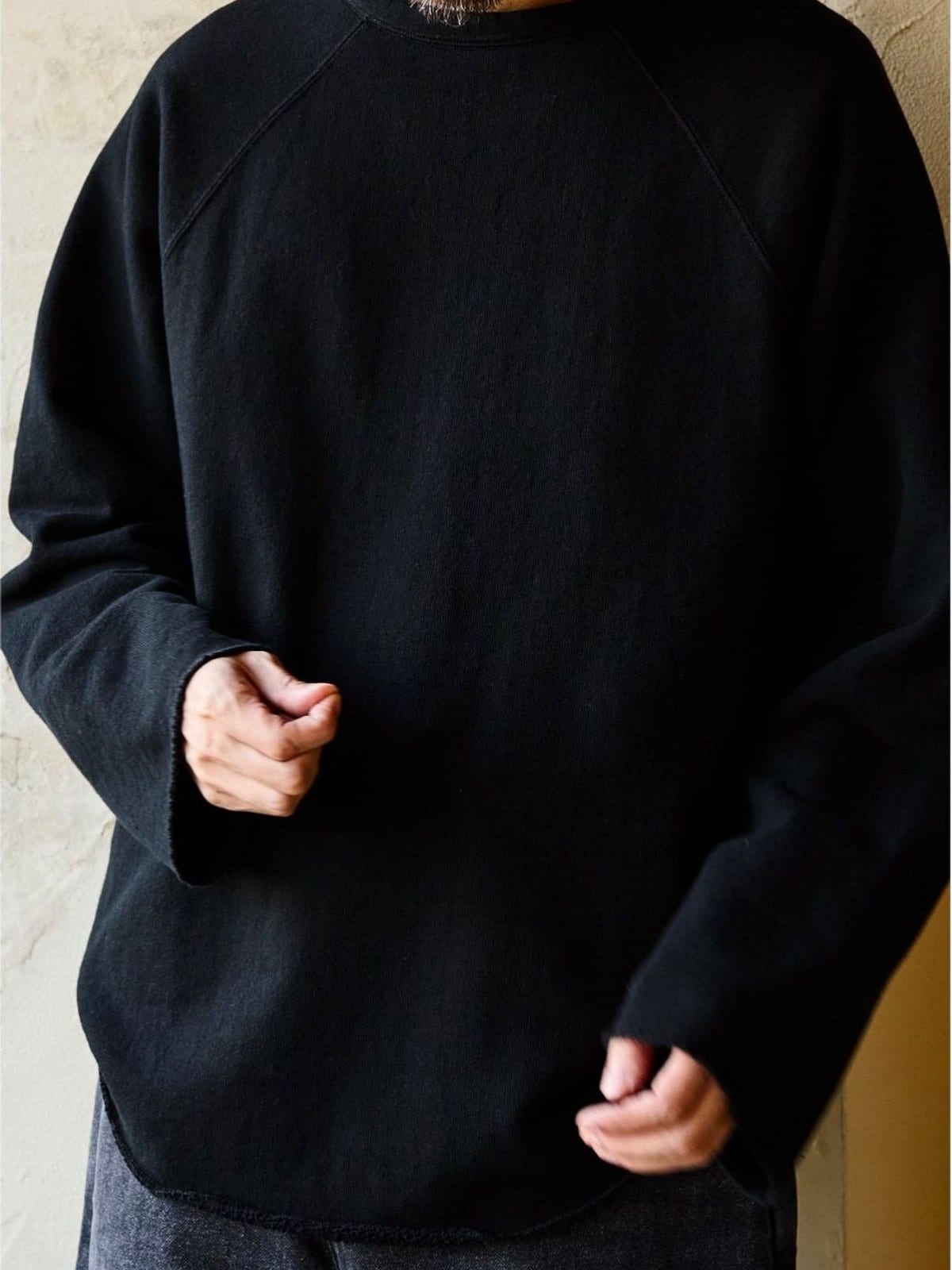 USAGE Slub Cotton Raglan Sweatshirt in Black - On Male Model