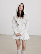 THELIGHT OFFICIAL Starfish Print Zip Up Hoodie in White - On Female Model