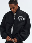 MEDM Nylon Stand Collar Coach Jacket in Black - On Male Model