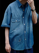 USAGE Distressed Short Sleeve Denim Shirt in Denim - On Male Model